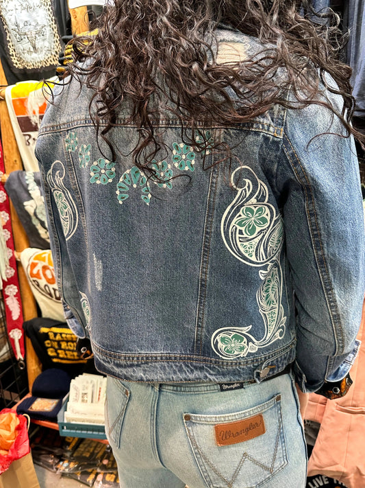 Denim jacket with Squash Blossom and tooled sides.