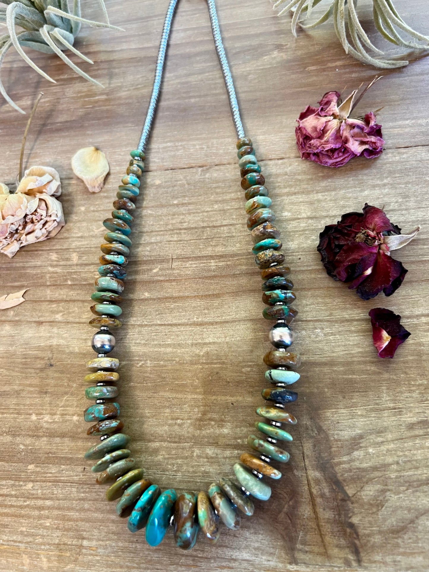 22 inch graduated turquoise necklace with Sterling silver pearls